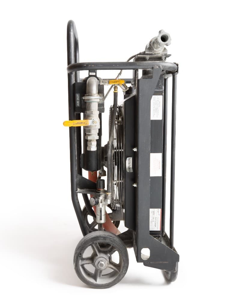 Side of the same rental aftercooler air dryer, showing the air outlet, valves, fan, and wheels.
