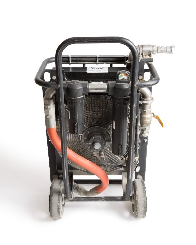 Front of a rental portable aftercooler, showing the fan and filters.